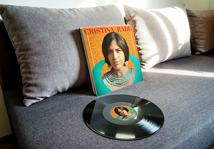 Mockup vinyl single cover custom jazz album cover design for Cristina Radu depicting the vynil on a sofa