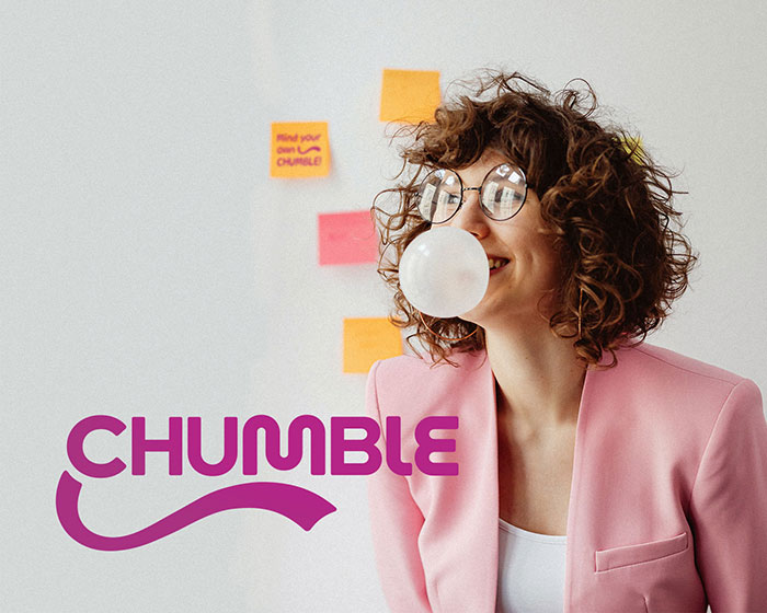 Chumble Chewing Gum primary logo depicted near a girl chewing gum in her office