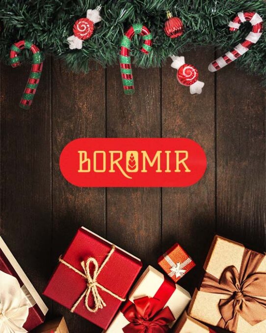 Boromir logotype places on a wooden table, alongside Christmas gifts and candies