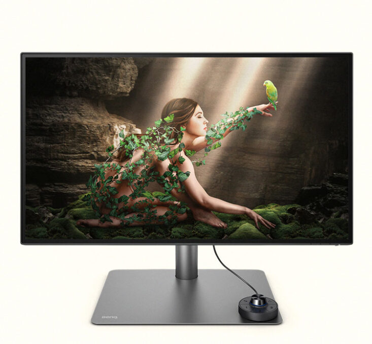 Inspired by nature Screensaver Design for BenQ Design Vue depicting a young woman covered in ivy and holding a parrot on here finger, in a cave under a beam of light