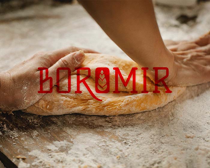 Boromir logotype placed on top of a photo featuring a woman kneading the dough