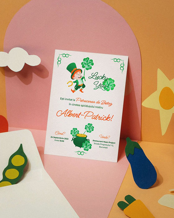 Custom illustrated digital baby shower invitation, baptism invitation, birthday invitation for your kids. Baptism invitation illustrated with elements and characters inspired by Saint Patrick's Day, a leprechaun, clover, pot of gold, because the child is named Patrick. The invitation is printed on paper ans surrounded by textile vegetables