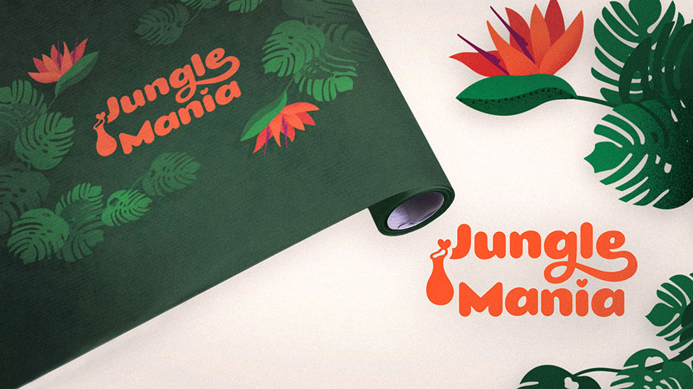 Tropical plant shop packaging design - wrapping paper decorated with a tropical illustration depicting Monstera Deliciosa leaves, Bird of paradise flowers and the brand logotype Jungle Mania. The logotype is repeated next to it, alongside a Bird of paradise flower and couple of Monstera leaves.
